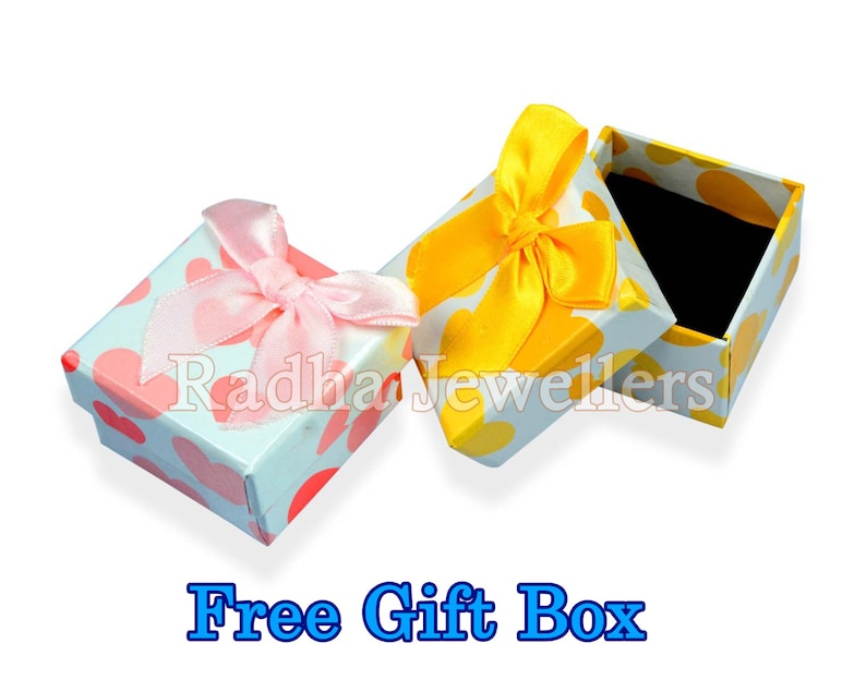 May include: Two small gift boxes with heart patterns and satin bows. One box has a pink bow, the other a yellow bow. The boxes are open, revealing a black interior. Text at the bottom reads "Free Gift Box".