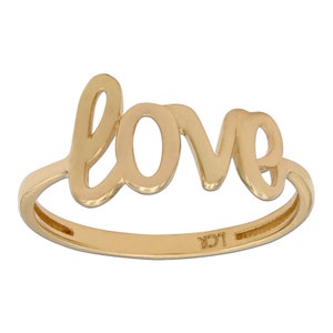 May include: A gold ring with the word "love" spelled out in a cursive font.