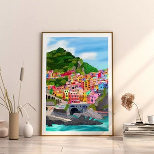 May include: A colourful illustration of a seaside town with buildings painted in bright hues of pink, yellow, blue, and green. The town is nestled against a lush green hillside and overlooks a turquoise ocean.