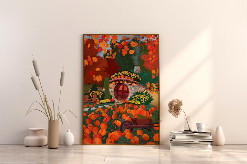 May include: A painting depicting a stone house with a red door, surrounded by autumn foliage and pumpkins. The house has a stone roof and a small window on the side. The pumpkins are scattered around the house, with some in a wheelbarrow.