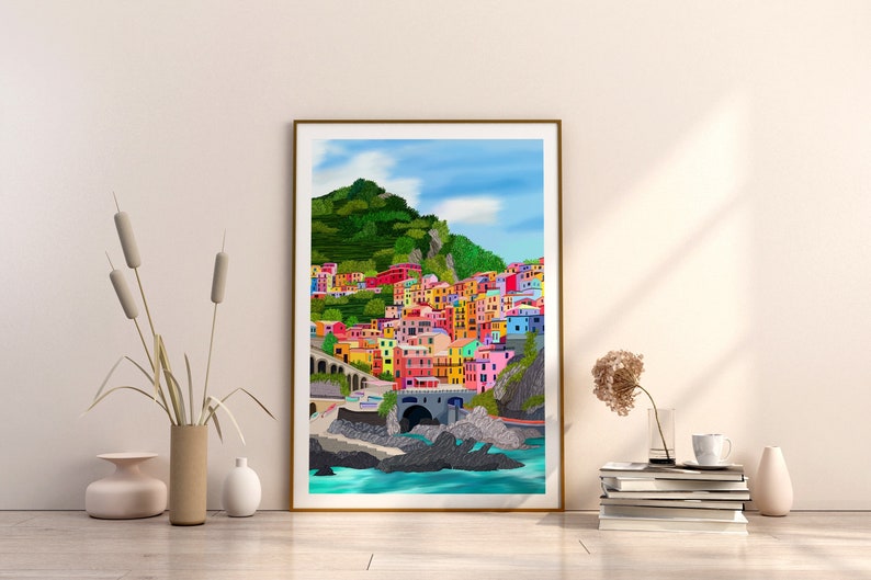 May include: A colourful illustration of a seaside town with buildings painted in bright hues of pink, yellow, blue, and green. The town is nestled against a lush green hillside and overlooks a turquoise ocean.