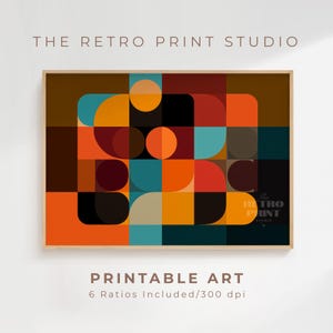 May include: A framed print featuring a geometric design with orange, teal, brown, and black shapes. The print includes the text "THE RETRO PRINT STUDIO" at the top and "PRINTABLE ART" at the bottom. The print is rectangular and has a wooden frame.