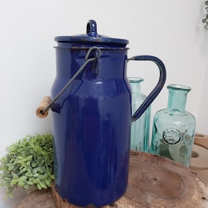 Blue enamel milk churn, enamelware, kitchen decoration.