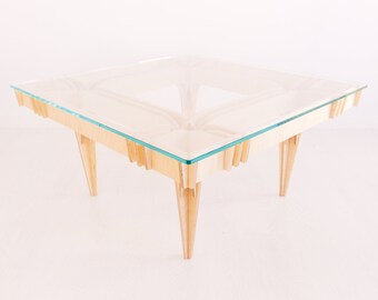 Sculptural coffee table, made on wood and glass, modern and artistic design.