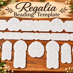 May include: A white Regalia Beading Template set featuring various shapes including bear paw prints and arrow designs with thin gray outlines, arranged on a wooden surface with pink flowers at the top and bottom corners of the frame.