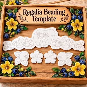 May include: A wooden box containing a Regalia Beading Template sign, white paper cutouts of a bear and floral shapes, and four corner arrangements of yellow beaded flowers with blue beaded berries and green beaded leaves.