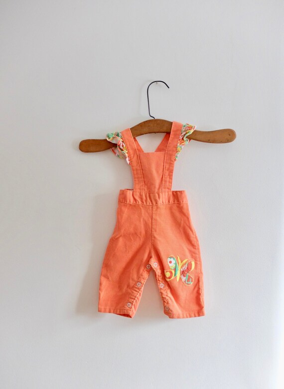 orange corduroy overalls