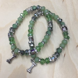 Charming Bracelet w/ Light Green Glass Beads, Sterling Silver Spacers, an a Cute Pewter Doggie Bone Charm.