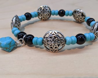 You will feel so special wearing this beautiful turquoise bracelet with black glass beads and pewter accents.