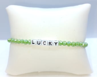 Green beads with plastic letter beads with the work Lucky.