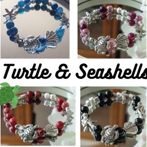 May include: Four beaded bracelets with turtle and seashell charms. The bracelets feature various colors of beads, including blue, purple, red, and black. Each bracelet has silver-toned charms of turtles, starfish, and seashells. The text "Turtle & Seashells" is also visible.