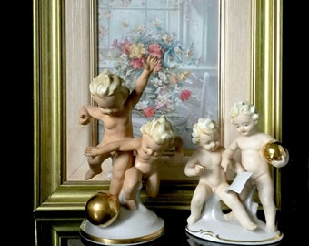 grafenthal  Carl Scheidig K.G. German  porcelain antique  figurine porcelain cherub with ball in gold . Rare