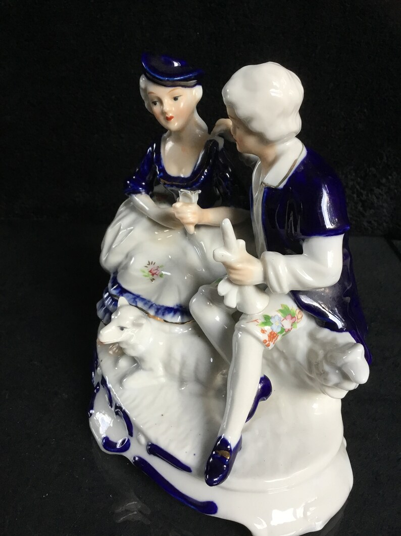 Vintage porcelain figurine in cobalt blue romantic couple