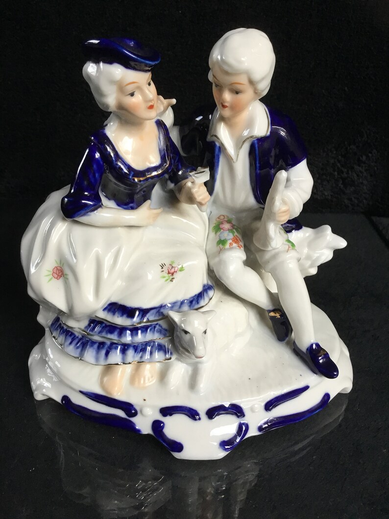 Vintage porcelain figurine in cobalt blue romantic couple