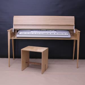 May include: A wooden keyboard stand with a hinged lid and a matching wooden stool. The keyboard is not included.