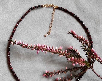red brown necklace made from the faceted red tiger eye beads and 18k gold plated brass