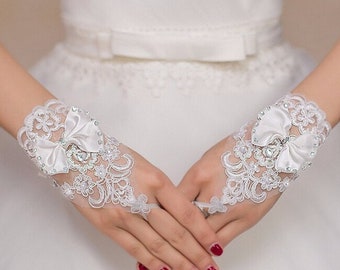 Pair of Short White Fingerless Lace Bridal Gloves With Wrist Bow & Diamonte Detail