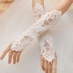 Pair of Ivory White Fingerless Bridal Gloves With Intricate