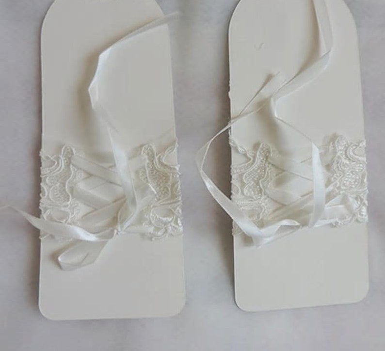 Pair of Short White Fingerless Lace Bridal Gloves With Wrist Bow & Diamonte Detail image 4