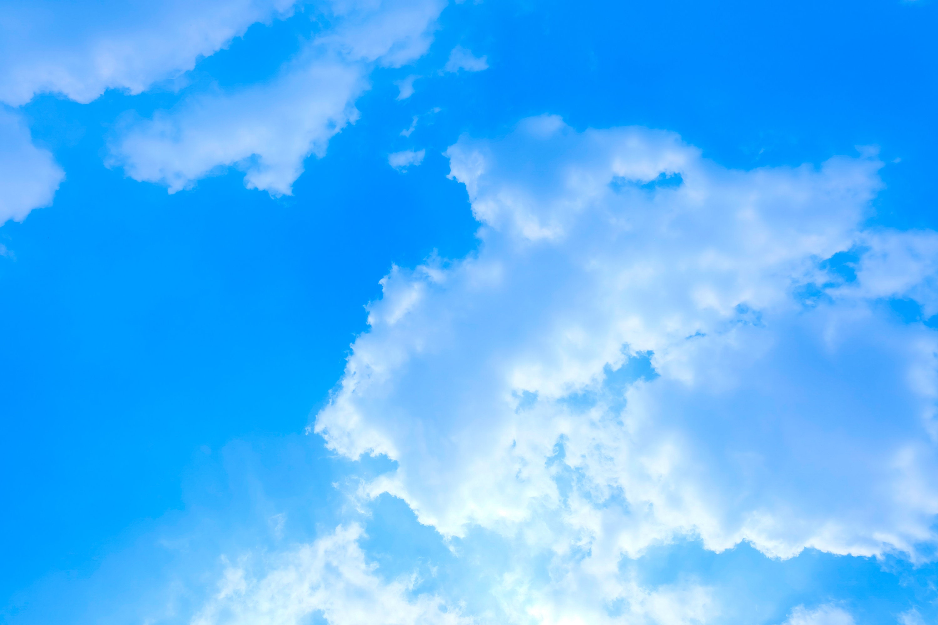 Blue sky background with fluffy white clouds beautifully shaped Stock Photo Alamy
