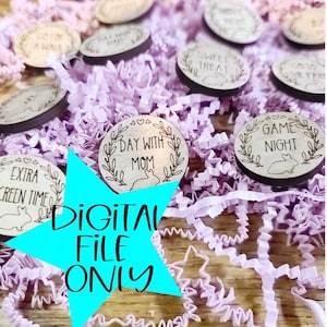 May include: A collection of wooden circle tokens with various phrases, including "Day with Mom", "Game Night", "Sweet Treat", and "Extra Screen Time". The tokens are scattered on a bed of purple shredded paper.