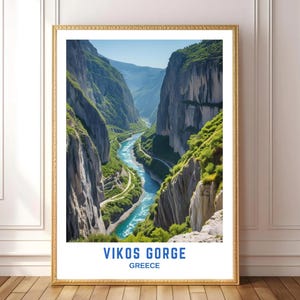 May include: A framed print featuring a scenic view of Vikos Gorge in Greece. The image showcases a turquoise river winding through a deep canyon with towering rock formations and lush green vegetation. The text "VIKOS GORGE" and "GREECE" are displayed at the bottom.