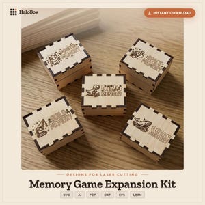 Peut inclure: Cinq boîtes carrées en bois avec des bords emboîtables, chacune présentant du texte et des illustrations gravés au laser. Les couvercles sont marqués Monster Memory, Space Memory, Dino Memory, Build Memory et Ocean Memory avec des icônes.