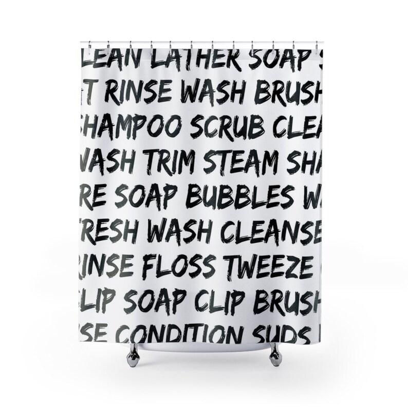 May include: White shower curtain with black text that reads "LEAN LATHER SOAP! IT RINSE WASH BRUSH SHAMPOO SCRUB CLEI VASH TRIM STEAM SHI RE SOAP BUBBLES W 'RESH WASH CLEANSE INSE FLOSS TWEEZE LIP SOAP CLIP BRUSH SE CONDITION SUDS|"
