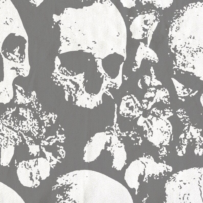 May include: A grey and white fabric with a repeating pattern of skulls and floral designs. The skulls are stylised and have a grunge aesthetic.