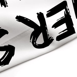 May include: Black and white graphic text on a white fabric background. The text reads "FREE".