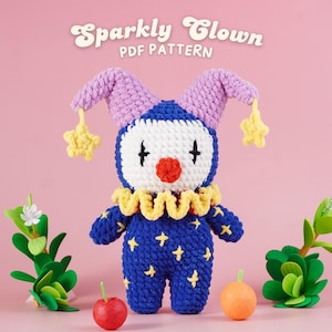 May include: A handmade crochet clown doll with a blue body adorned with yellow stars. The clown has a white face, red nose, and black eyes. It wears a yellow ruffled collar and purple ears with yellow star accents. The text "Sparkly Clown PDF Pattern" is at the top.