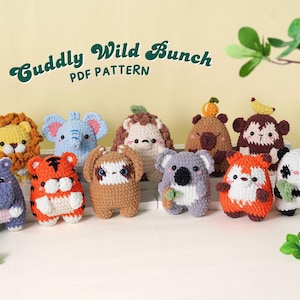 May include: A collection of handmade crochet animal toys, including a lion, elephant, tiger, sloth, koala, fox, and panda. The toys are colorful and have cute, friendly expressions. The text "Cuddly Wild Bunch PDF Pattern" is displayed above the toys.