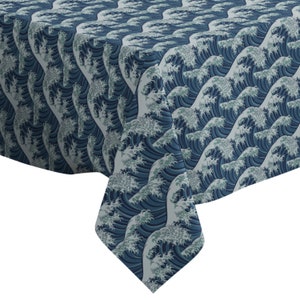 May include: A blue and white tablecloth with a repeating pattern of stylized waves. The tablecloth is made of a soft, durable fabric and is perfect for adding a touch of elegance to any dining table.