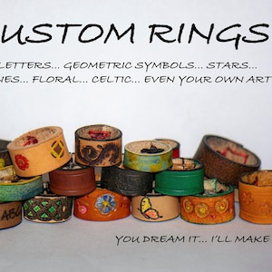 Two Handcrafted Leather Rings with Personalized Engravings.