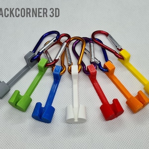 May include: Seven colourful keychains with a carabiner clip and a plastic hook. The keychains are grey, green, blue, white, red, orange and yellow.