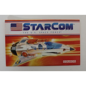 Katalog Starcom STARMAX BOMBER z 1986 r. - 3,43" x 2,17" (8,7 x 5,5 cm.) Zamknięty - Coleco - Oryginalna europejska dokumentacja vintage (NIE kopia)
