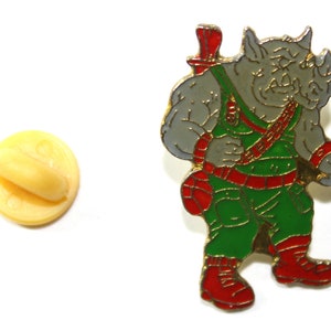 1990s Teenage Mutant Ninja Turtles (TMNT) ROCKSTEADY Lapel Pin - Hard To Find - 3 x 2 cm. ( 1.2&quot; x 0.8&quot; )