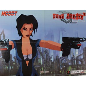 May include: Poster for the video game "Fear Effect 2: Retro Helix" featuring a female character holding two guns. The poster has a blue and gray industrial background with the word "HOBBY" at the top left.