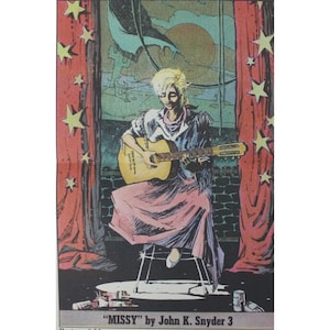 May include: A woman with blonde hair plays a guitar on a stage with red curtains and stars. The text "MISSY" by John K. Snyder 3 is at the bottom of the image.