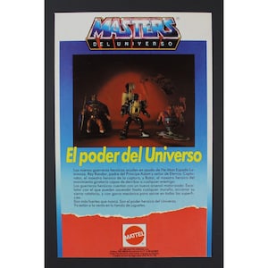Puede incluir: Figuras de acción de Masters of the Universe, incluyendo a He-Man, el Rey Randor y Rotar. Las figuras están en una escena de acción dinámica con un fondo de ciudad futurista. El texto "El poder del Universo" aparece en la imagen.