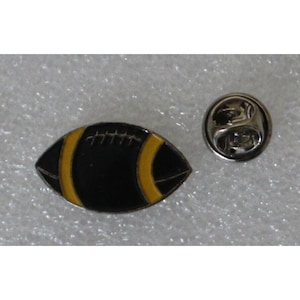 1980s American FOOTBALL / RUGBY BALL Lapel Pin 1&quot; x 0.6&quot; (2.5 x 1.5 cm.) Black - Yellow Stripes