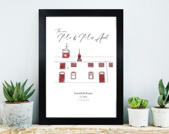 May include: A black framed print with a white background. The print features a hand-drawn illustration of a building with a clock tower. The text "The new Mr. & Mrs. Andl" is written in cursive at the top of the print. The text "Lauchfield Estate, Co. Antrim 4.8.2023" is written at the bottom of the print.