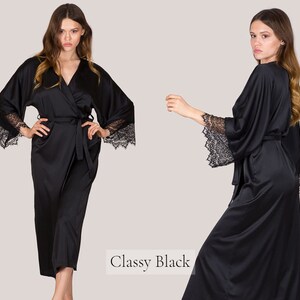 May include: A black satin robe with lace trim on the sleeves. The robe is tied at the waist with a matching sash. The text "Classy Black" is visible in the image.