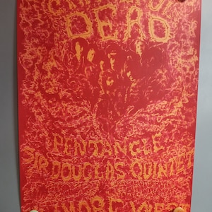 May include: A red and yellow concert poster featuring the text Grateful Dead, Pentangle, Sir Douglas Quintet, and Fillmore West. The poster displays a central group of figures surrounded by intricate, swirling patterns and is held by four pins.