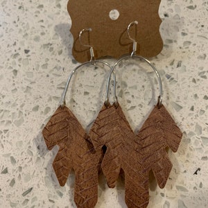 Light brown braided faux leather feather hoop earrings
