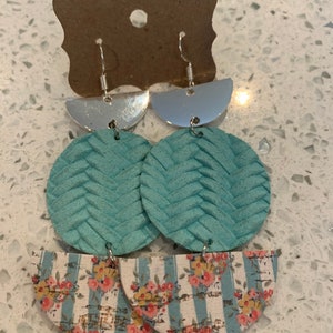 Triple drop leather earrings. Metal half circle, robin egg braided leather and cork on leather stripes with roses.