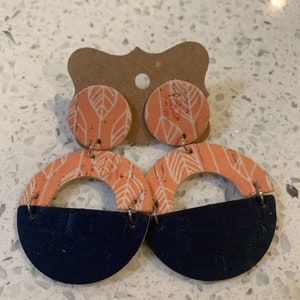 Orange leaf half circle cut out with stud and navy half circle earring.