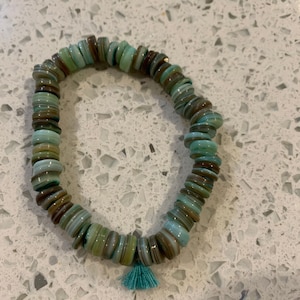 Multicolored blue beaded bracelet with blue tassel