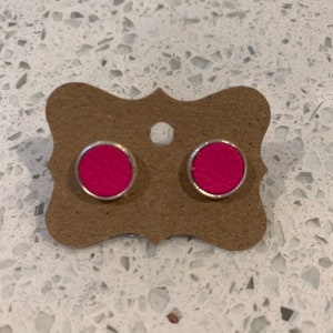 Neon pink leather stud earrings set in silver