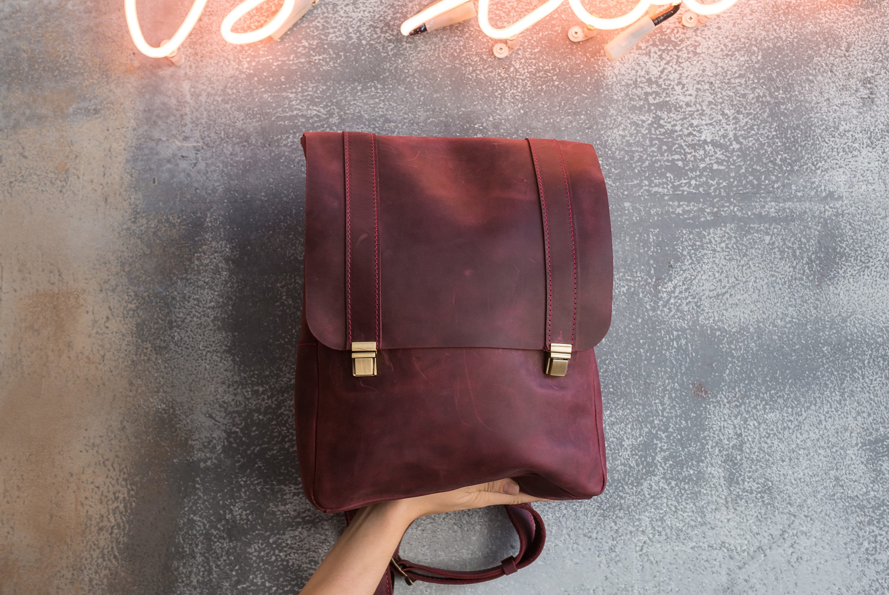 maroon leather backpack